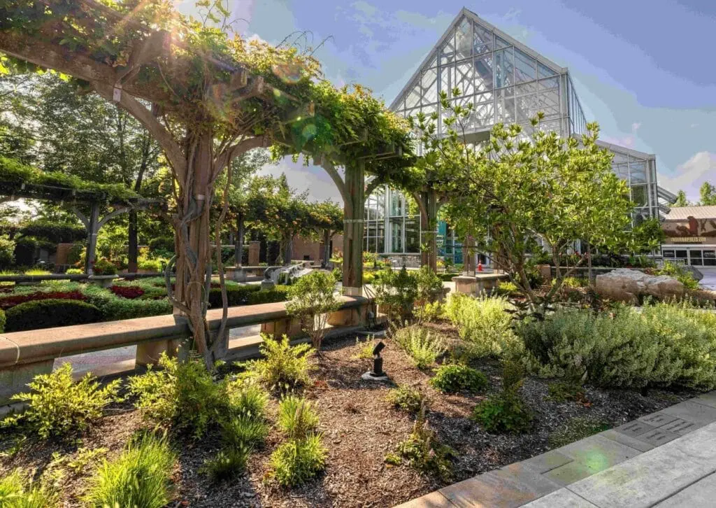 Image showing trees in front of a large glass house at the Indianapolis Zoo